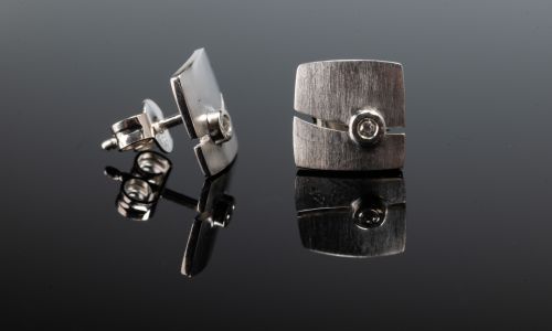 Brushed silver square stud earrings with 0.02CT diamonds.